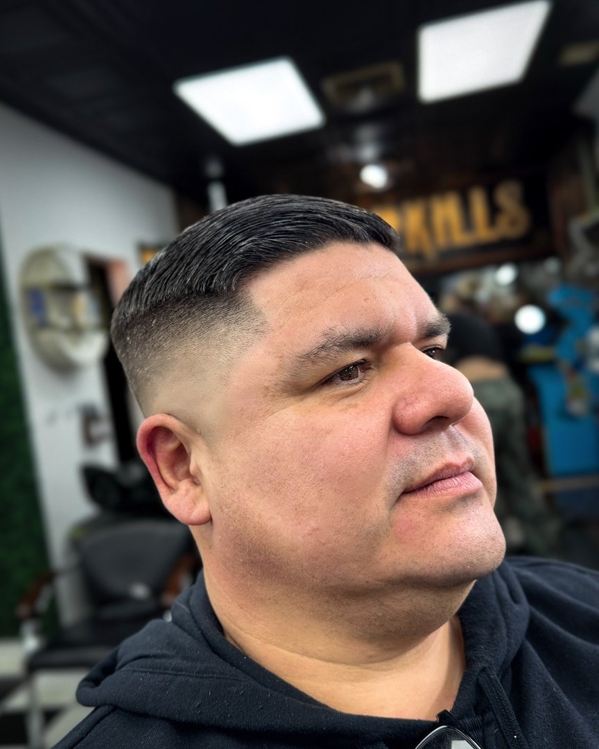 Classic comb-over with a low fade at Fresh Kills Barbershop